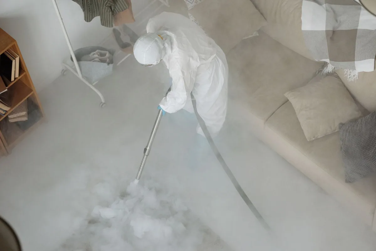 Biohazard cleanup technician in protective equipment, West Brow, GA